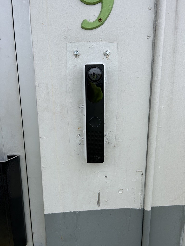 Commercial access control reader and intercom installed at a secure entry